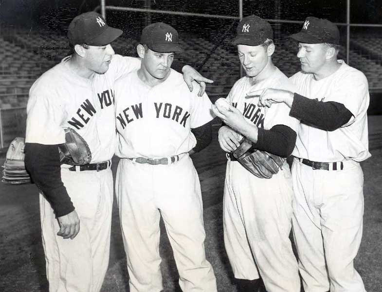 Yankee manager Yogi Berra (8) signals the bullpen for a new hurler