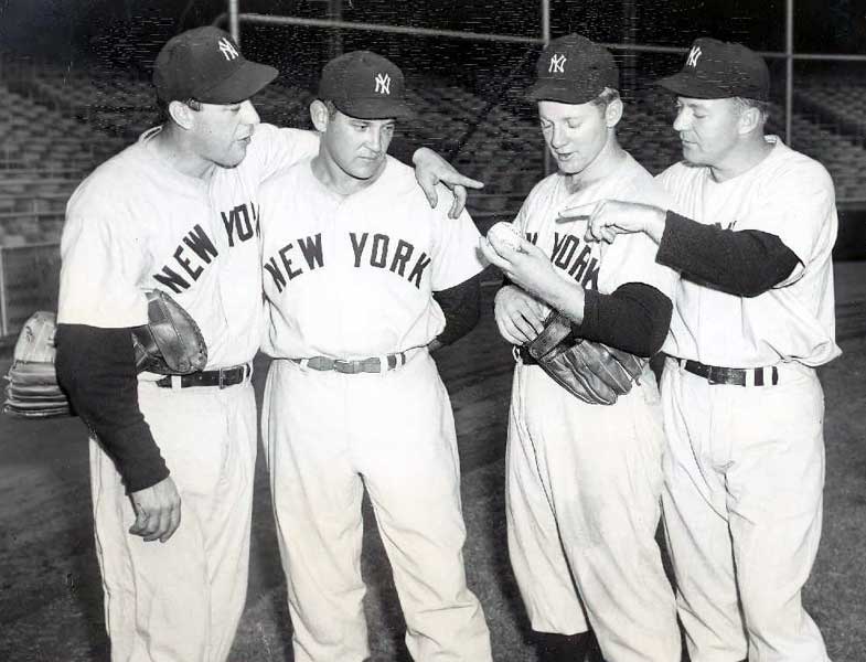 Yankee manager Yogi Berra (8) signals the bullpen for a new hurler after  Whitey Ford, hand on hips, has been rocked for a two-run homer by the  Cardinals in sixth inning of